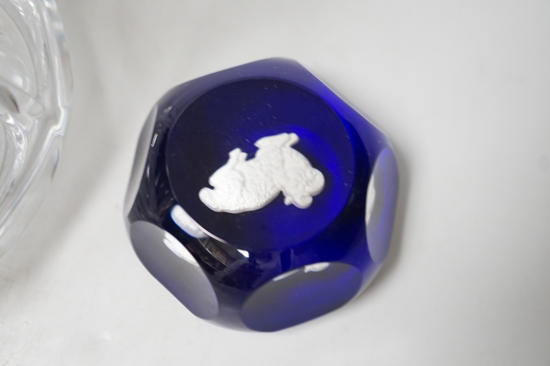 A Baccarat decanter and a Baccarat sulphide paperweight. Tallest 24cm